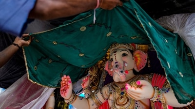 An idol of lord Ganesh is looked at before buying, in New Delhi's Mayur Vihar ahead of Ganesh Chaturthi celebrations in the country. (Salman Ali/PTI) An idol of lord Ganesh is looked at before buying, in New Delhi's Mayur Vihar ahead of Ganesh Chaturthi celebrations in the country. (Salman Ali/PTI)