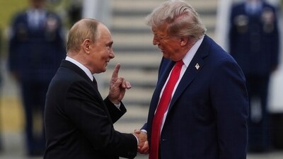 Trump showed their picture to the reporter and stated, “That's a man named Vladimir Putin who I believe will be coming depending on what happens." (AP) Trump showed their picture to the reporter and stated, “That's a man named Vladimir Putin who I believe will be coming depending on what happens." (AP)