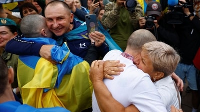 Olha embraces her son Yevhen, a freed Ukrainian prisoner of war (POW), as he left a bus after a swap, amid Russia's attack on Ukraine, in an undisclosed location in Ukraine on August 24, 2025. (REUTERS)