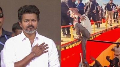 Vijay was walking to the stage at the Madurai maanaadu when he noticed a fan dangerously hanging off a railing to meet him. (ANI) Vijay was walking to the stage at the Madurai maanaadu when he noticed a fan dangerously hanging off a railing to meet him. (ANI)