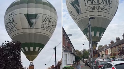 The balloon, which had veered off course, descended quickly between terraced homes as stunned residents watched. (X/@aviationbrk)