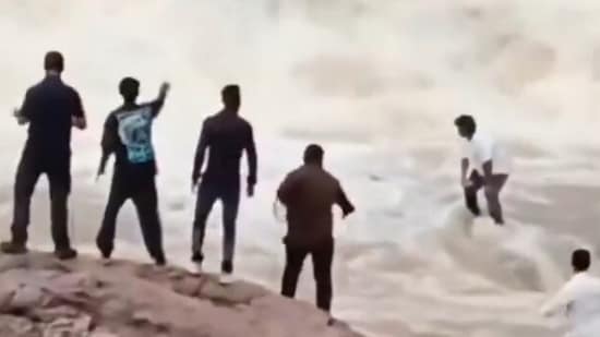 YouTuber Sagar Tudu was seen stranded amid the current at the Duduma waterfall in Odisha. (Video grab/X/@AshishDevliyal1)