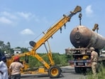 Police and rescue teams use a crane to remove the damaged LPG tanker-truck at Mandalia village in Hoshiarpur district. 