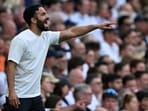 Manchester United's head coach Ruben Amorim shouts instructions to the players from the touchline.
