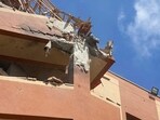 Palestinians try to reach causalties following Israeli strikes on Nasser hospital in Khan Yunis in the southern Gaza Strip on August 25