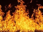 The woman returned from school, sat on a chair, poured petrol on herself and her daughter and set themselves on fire. 