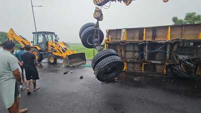 A 22-wheeler truck-trailer overturned after a road cave-in near Sangrur bypass on the Bathinda-Chandigarh National Highway early Monday morning.