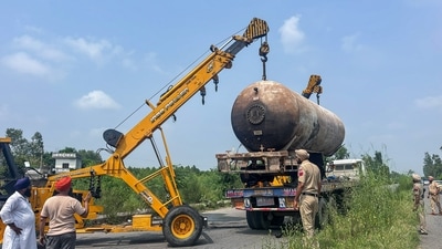 Police and rescue teams use a crane to remove the damaged LPG tanker-truck at Mandalia village in Hoshiarpur district. (ANI File) Police and rescue teams use a crane to remove the damaged LPG tanker-truck at Mandalia village in Hoshiarpur district. (ANI File)