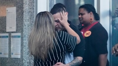 Jennifer Vasquez Sura, left, hugs her husband Kilmar Abrego Garcia at the Immigration and Customs Enforcement field office in Baltimore, Monday, Aug. 25, 2025. (AP Photo/Stephanie Scarbrough) (AP)