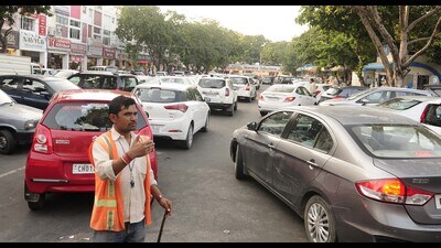At present, attendants at issue parking slips and collect payments manually. (HT File) At present, attendants at issue parking slips and collect payments manually. (HT File)