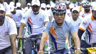 File image of Union Minister of Youth Affairs and Sports Mansukh Mandaviya riding a bicycle as part of the 'Fit India Sundays on Cycle' initiative. (PTI)
