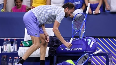 Daniil Medvedev breaks his racket after losing in five sets to Benjamin Bonzi of France. (Getty Images via AFP) Daniil Medvedev breaks his racket after losing in five sets to Benjamin Bonzi of France. (Getty Images via AFP)