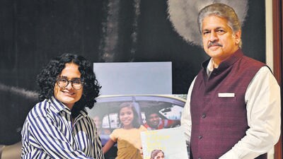 Mahindra Group chairperson Anand Mahindra launches 18-year-old author-photographer Nitya Manoj Kumar’s book May A Million Buds Bloom in Mumbai. (Anshuman Poyrekar/ Hindustan Times) Mahindra Group chairperson Anand Mahindra launches 18-year-old author-photographer Nitya Manoj Kumar’s book May A Million Buds Bloom in Mumbai. (Anshuman Poyrekar/ Hindustan Times)