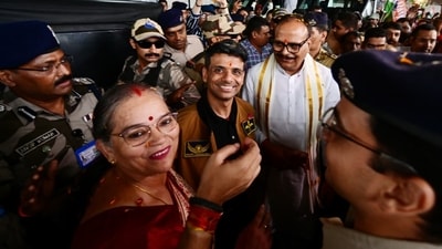 Group Captain Shubhanshu Shukla welcomed by Deputy Chief Minister Brajesh Pathak at the airport as security surrounds them. (Deepak Gupta/ Hindustan Times) Group Captain Shubhanshu Shukla welcomed by Deputy Chief Minister Brajesh Pathak at the airport as security surrounds them. (Deepak Gupta/ Hindustan Times)