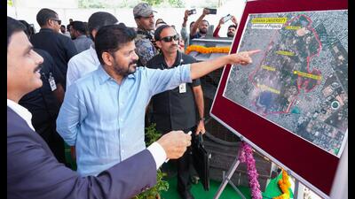 Telangana Chief Minister Revanth Reddy inspecting a map during the inauguration of newly constructed hostels at Osmania University, in Hyderabad on Monday. (AGENCIES) Telangana Chief Minister Revanth Reddy inspecting a map during the inauguration of newly constructed hostels at Osmania University, in Hyderabad on Monday. (AGENCIES)
