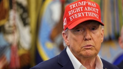 US President Donald Trump wears a 'Trump Was Right About Everything!' hat as he makes an announcement in the Oval Office at the White House in Washington, D.C. (REUTERS File)