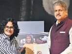 Mahindra Group chairperson Anand Mahindra launches 18-year-old author-photographer Nitya Manoj Kumar’s book May A Million Buds Bloom in Mumbai. (Anshuman Poyrekar/ Hindustan Times)