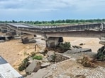 Portion of a bridge on the Jammu-Pathankot national highway was damaged due to overflowing of Sahar Khad nallah following heavy rainfall, in Kathua, on Sunday. Portion of a bridge on the Jammu-Pathankot national highway was damaged due to overflowing of Sahar Khad nallah following heavy rainfall, in Kathua, on Sunday.