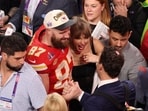 Taylor Swift and Travis Kelce pose together after a Super Bowl game