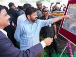 Telangana Chief Minister Revanth Reddy inspecting a map during the inauguration of newly constructed hostels at Osmania University, in Hyderabad on Monday. (AGENCIES)