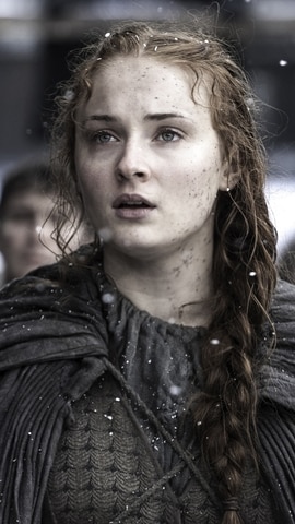 Sophie Turner portrayed Sansa Stark in Game of Thrones, and was 15, when the show first premiered on HBO. Sophie Turner portrayed Sansa Stark in Game of Thrones, and was 15, when the show first premiered on HBO.