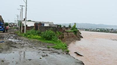 A house that was damaged due to flash flood in the Tawi river on the outskirts of Jammu city. Overnight rain across the region has led to the rise in water level on Tuesday. (ANI Photo) A house that was damaged due to flash flood in the Tawi river on the outskirts of Jammu city. Overnight rain across the region has led to the rise in water level on Tuesday. (ANI Photo)