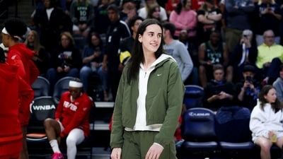Caitlin Clark #22 of the Indiana Fever walks on the court before a game against the Minnesota Lynx at Target Center (Getty Images via AFP) Caitlin Clark #22 of the Indiana Fever walks on the court before a game against the Minnesota Lynx at Target Center (Getty Images via AFP)