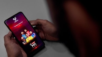 A user checks the Dream11 application of the Indian Premier League (IPL) cricket tournament, on his mobile phone in New Delhi. Parliament has passed a sweeping bill banning online gambling, after government figures showed companies had stripped $2.3 billion annually from 450 million people. (AFP) A user checks the Dream11 application of the Indian Premier League (IPL) cricket tournament, on his mobile phone in New Delhi. Parliament has passed a sweeping bill banning online gambling, after government figures showed companies had stripped $2.3 billion annually from 450 million people. (AFP)