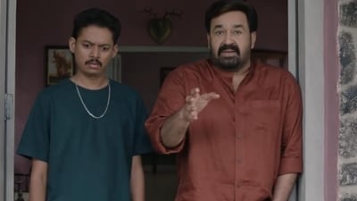 Mohanlal and Sangeeth Prathap in a still from Hridayapoorvam. Mohanlal and Sangeeth Prathap in a still from Hridayapoorvam.