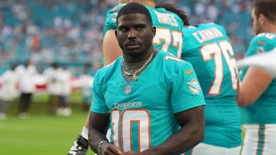 Miami Dolphins star Tyreek Hill faces a costly divorce, ordered to pay $20,000 to $50,000 monthly in support and cover legal fees. (AP Photo/Rebecca Blackwell) (AP) Miami Dolphins star Tyreek Hill faces a costly divorce, ordered to pay $20,000 to $50,000 monthly in support and cover legal fees. (AP Photo/Rebecca Blackwell) (AP)