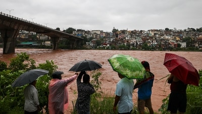 People look at the swollen Tawi river amid rainfall, in Jammu, Tuesday, Aug. 26, 2025. (PTI) People look at the swollen Tawi river amid rainfall, in Jammu, Tuesday, Aug. 26, 2025. (PTI)
