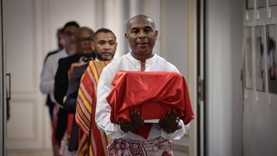 A man carries one of the three Sakalava skulls during a ceremony for their restitution to Madagascar, at the Culture Ministry in Paris, on August 26, 2025. (AFP) A man carries one of the three Sakalava skulls during a ceremony for their restitution to Madagascar, at the Culture Ministry in Paris, on August 26, 2025. (AFP)