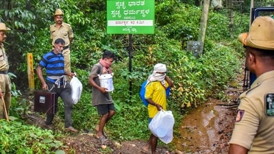 Dakshina Kannada: Workers leave from a site of an alleged burial related to the Dharmasthala mass burial case, at Dharmasthala, in Dakshina Kannada district, (PTI) Dakshina Kannada: Workers leave from a site of an alleged burial related to the Dharmasthala mass burial case, at Dharmasthala, in Dakshina Kannada district, (PTI)