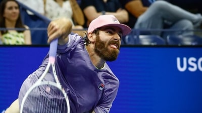 Reilly Opelka serves the ball to Spain's Carlos Alcaraz during their men's singles first round tennis match against on day two of the US Open tennis tournament at the USTA Billie Jean King National Tennis Center in New York City, on August 25, 2025. (Photo by Kena Betancur / AFP) (AFP) Reilly Opelka serves the ball to Spain's Carlos Alcaraz during their men's singles first round tennis match against on day two of the US Open tennis tournament at the USTA Billie Jean King National Tennis Center in New York City, on August 25, 2025. (Photo by Kena Betancur / AFP) (AFP)