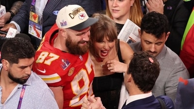 Taylor Swift and Travis Kelce pose together after a Super Bowl game (REUTERS)