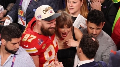 Taylor Swift and Travis Kelce pose together after a Super Bowl game (REUTERS)