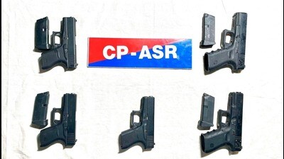 The seized 9mm Glock pistols and magazines were seized from (HT) The seized 9mm Glock pistols and magazines were seized from (HT)