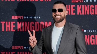 Kansas City Chiefs tight end Travis Kelce poses on the red carpet before a screening of the ESPN series, The Kingdom. (AP)