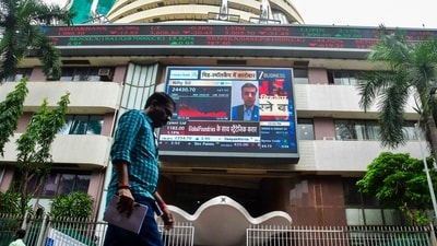 A man walks past the Bombay Stock Exchange (BSE) building, in Mumbai (PTI/File) A man walks past the Bombay Stock Exchange (BSE) building, in Mumbai (PTI/File)