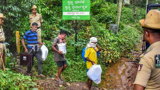 Dakshina Kannada: Workers leave from a site of an alleged burial related to the Dharmasthala mass burial case, at Dharmasthala, in Dakshina Kannada district, (PTI)