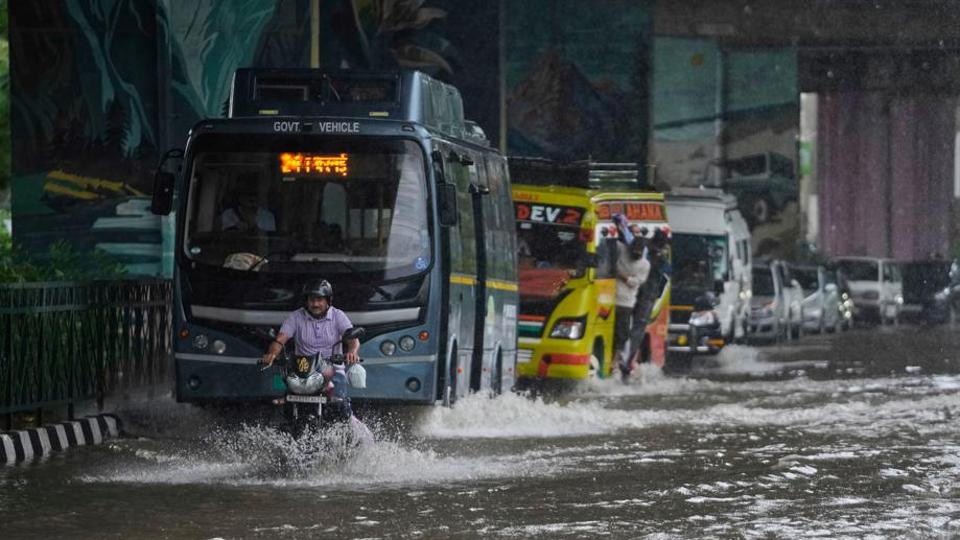Commuters driving through a flooded road after heavy rain in Jammu on Tuesday. (AP Photo) Commuters driving through a flooded road after heavy rain in Jammu on Tuesday. (AP Photo)