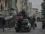 Displaced Palestinians fleeing Jabalia move with their belongings on a street in Gaza City on Tuesday, 26 August 2025. Displaced Palestinians fleeing Jabalia move with their belongings on a street in Gaza City on Tuesday, 26 August 2025.