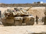 Israeli army main battle tanks are positioned near the border with the Gaza Strip in southern Israel on August 27, 2025. Israeli military pressed operations around Gaza City on August 27, as President Donald Trump prepared to host a White House meeting on post-war plans for the shattered Palestinian territory. (Photo by Jack GUEZ / AFP) Israeli army main battle tanks are positioned near the border with the Gaza Strip in southern Israel on August 27, 2025. Israeli military pressed operations around Gaza City on August 27, as President Donald Trump prepared to host a White House meeting on post-war plans for the shattered Palestinian territory. (Photo by Jack GUEZ / AFP)