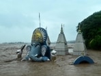 A temple lies partially submerged in floodwaters after heavy rain induced a rise in the water level of river Tawi in Jammu on August 26, 2025. A temple lies partially submerged in floodwaters after heavy rain induced a rise in the water level of river Tawi in Jammu on August 26, 2025.