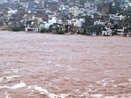 The overflowing Tawi river following heavy rainfall in Jammu on Tuesday. (Reuters) The overflowing Tawi river following heavy rainfall in Jammu on Tuesday. (Reuters)