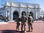 Armed members of the National Guard patrol outside of Union Station in Washington DC. Armed members of the National Guard patrol outside of Union Station in Washington DC.