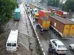 Vehicles wade through a waterlogged stretch after heavy rain on the National Highway-48 service road on Tuesday. (Parveen Kumar/HT) Vehicles wade through a waterlogged stretch after heavy rain on the National Highway-48 service road on Tuesday. (Parveen Kumar/HT)