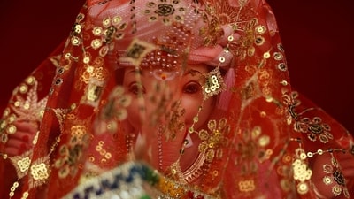 An idol of the Hindu god Ganesh is covered with a cloth on the eve of the ten-day-long Ganesh Chaturthi festival in Mumbai. (Reuters)