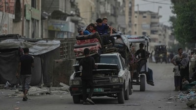 Displaced Palestinians fleeing Jabalia move with their belongings on a street in Gaza City on Tuesday, 26 August 2025. (AP) Displaced Palestinians fleeing Jabalia move with their belongings on a street in Gaza City on Tuesday, 26 August 2025. (AP)