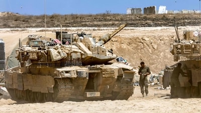 Israeli army main battle tanks are positioned near the border with the Gaza Strip in southern Israel on August 27, 2025. Israeli military pressed operations around Gaza City on August 27, as President Donald Trump prepared to host a White House meeting on post-war plans for the shattered Palestinian territory. (Photo by Jack GUEZ / AFP) (AFP) Israeli army main battle tanks are positioned near the border with the Gaza Strip in southern Israel on August 27, 2025. Israeli military pressed operations around Gaza City on August 27, as President Donald Trump prepared to host a White House meeting on post-war plans for the shattered Palestinian territory. (Photo by Jack GUEZ / AFP) (AFP)